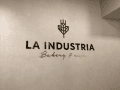 La Industria Bakery & Cafe logo